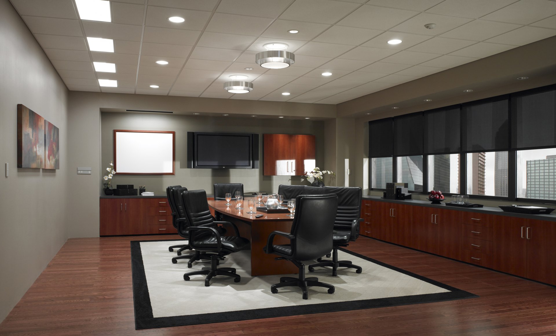 Executive boardroom with integrated lighting control and automated shades